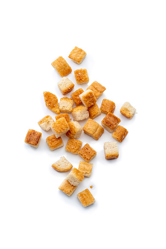 Croutons in a pile, isolated on a white background. High angle view