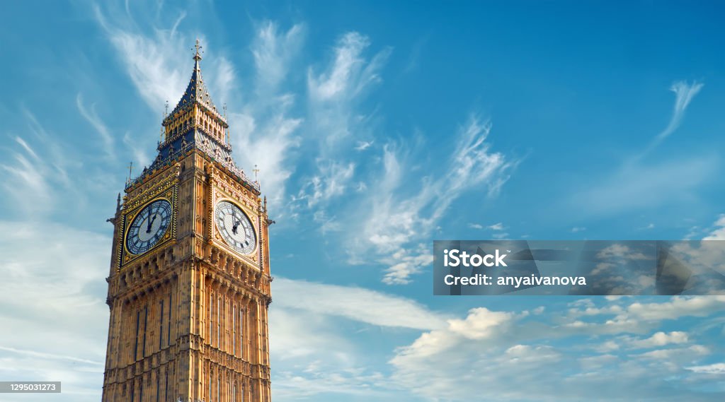 Big Ben Clock Tower in London, UK, on a bright day. Panoramic composition with text space on blue sky with feather clouds Big Ben Clock Tower in London, UK, on a bright day. Panoramic composition withcopy-space, text space on blue sky with feather clouds. Big Ben Stock Photo