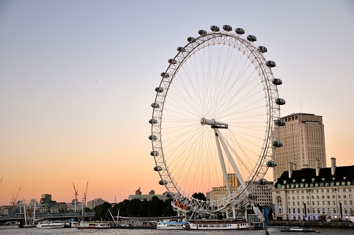 London, UK: September 30, 2015: London Eye. View of the wheel at sunset.