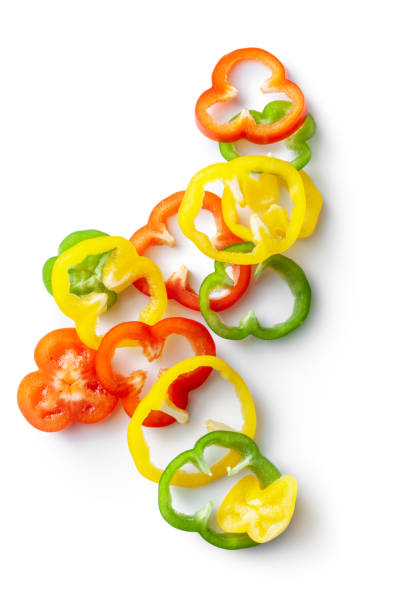 vegetables: sliced bell peppers isolated on white background - sectional elevation imagens e fotografias de stock