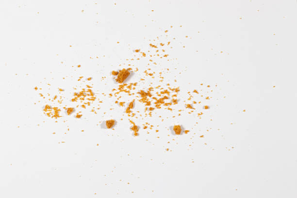 istock Scattered crumbs isolated on white background 1295037392