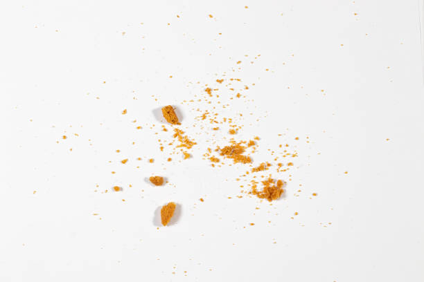 istock Scattered crumbs isolated on white background 1295037529