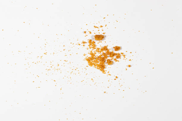 istock Scattered crumbs isolated on white background 1295037564