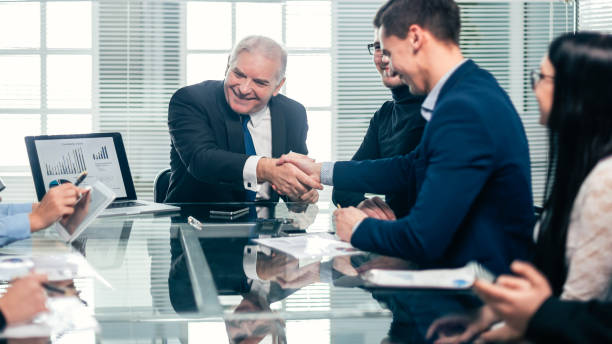 istock business colleagues shaking hands during a work meeting 1295038497