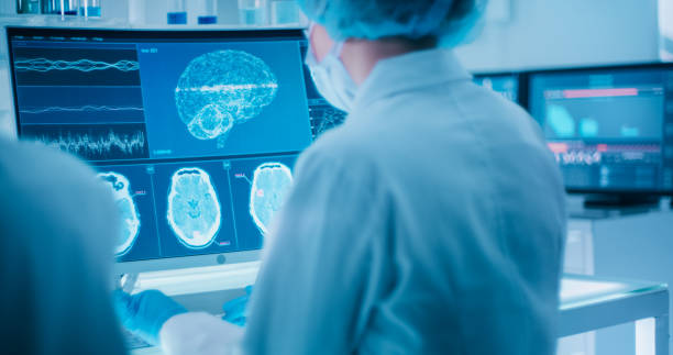 istock Female scientists studying brainwave scanning models and DNA sequences 1295039464