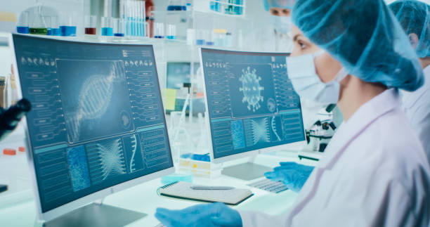 istock Young female microbiologists studying coronavirus. Futuristic lab 1295039475