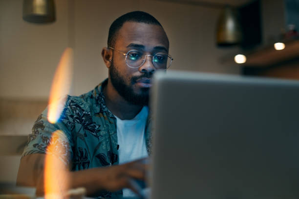 istock One man working late at home. 1295040867