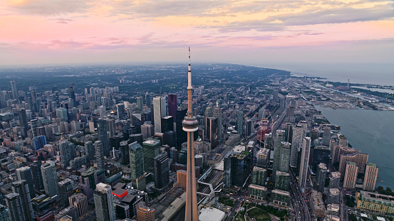 Aerial view of modern cityscape with CN Tower at sunset, Toronto, Ontario, Canada.