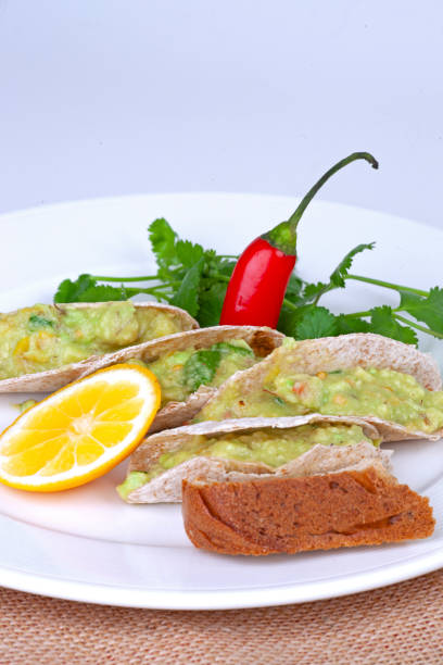 istock a mexican tacos with avocado on the table 1295042303