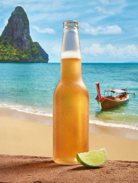 istock Beer by a tropical beach with lime 1295044797