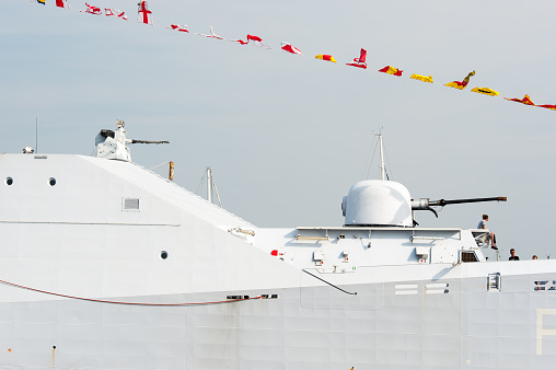 The main 76mm cannon and secondary rapid fire 30mm gun of HNLMS Friesland, a Holland-class offshore patrol vessel operated by the Royal Netherlands Navy. The warship was a special guest at Sail Amsterdam event in 2015.