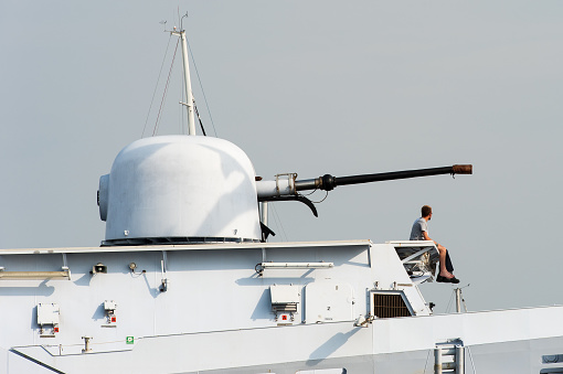 The main 76mm gun of HNLMS Friesland, a Holland-class offshore patrol vessel operated by the Royal Netherlands Navy. The warship was a special guest at Sail Amsterdam event in 2015.