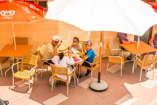 people at the restaurant Valletta Malta, July 18 2019.  View of the beautiful streets of Malta and people at the restaurant knights of malta stock pictures, royalty-free photos & images