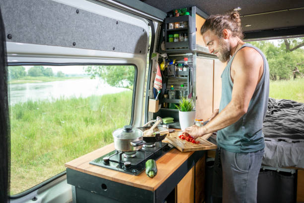 Young man living in a camper van
