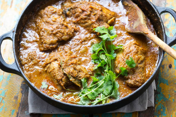 istock Punjabi chicken curry with coriander. Classic indian masala. 1295049636
