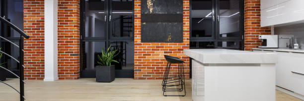 istock Panorama of white kitchen in loft 1295049707