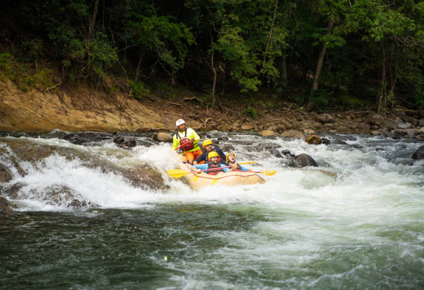 istock Raft moving fast on. a rpadi river in Central America 1295055222