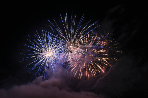 istock Fireworks light up the sky with smoke. Colorful. 1295056096