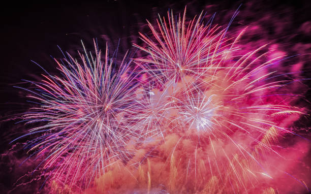 istock Fireworks light up the sky with smoke. Colorful. 1295056178