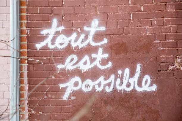 all is possible - graffiti believe wall single word imagens e fotografias de stock