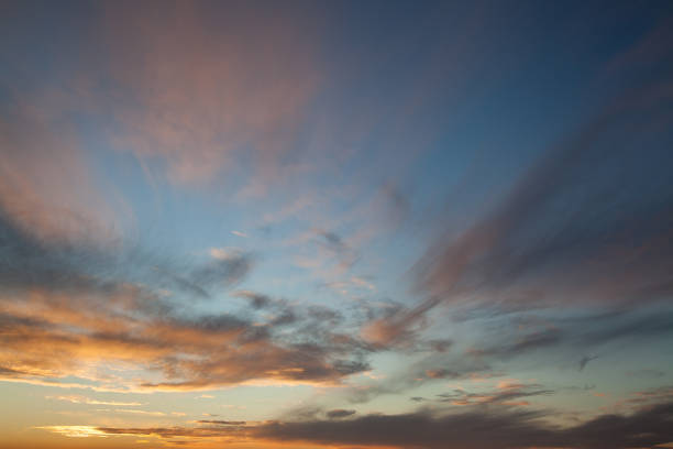 istock blue sky in the dusk with clouds 1295057530