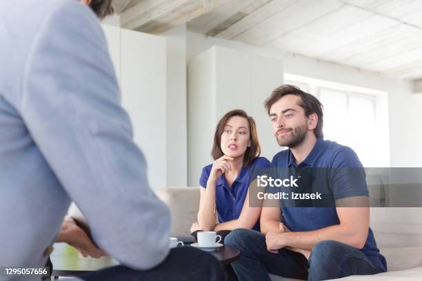 Couple Discussing Problems With Psychotherapist Stock Photo - Download Image Now - 30-39 Years, Adult, Adults Only