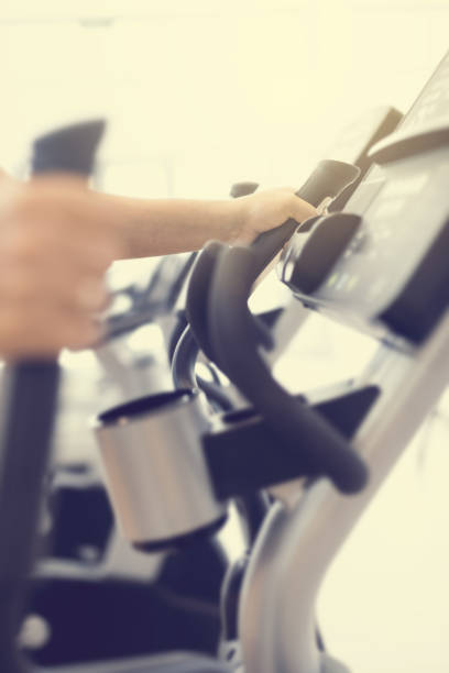 istock Cardio workout on an elliptical machine in gym 1295059980
