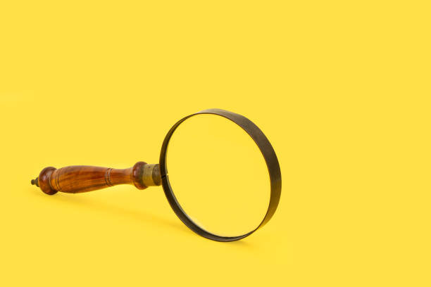 istock A magnifying glass on a yellow background 1295061391
