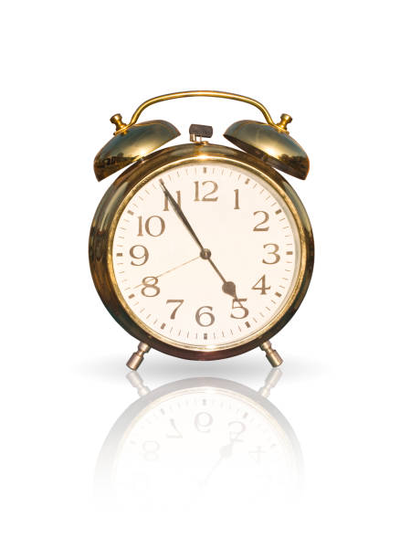 istock Golden alarm clock on white background 1295066256
