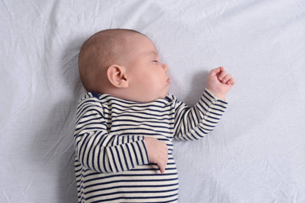 istock the baby lying and sleeping 1295069357