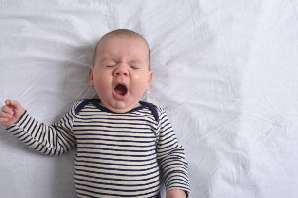 istock relaxed baby yawning 1295069890