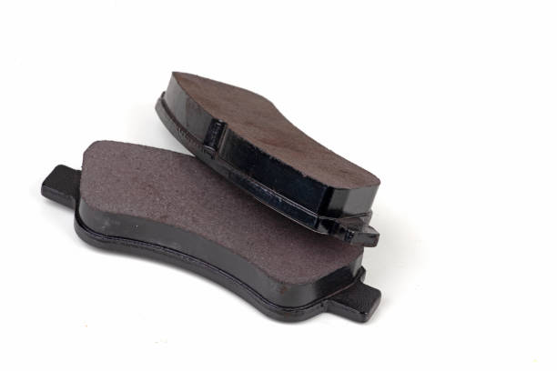 istock brake pads isolated on white. Auto parts 1295072521