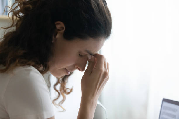 istock Close up unhappy woman touching nose bridge, suffering from headache 1295072582