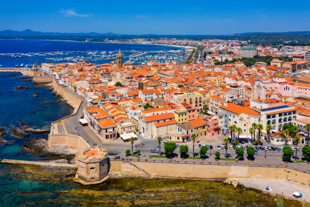 istock Aerial view over Alghero old town, cityscape Alghero view on a beautiful day with harbor and open sea in view. Alghero, Italy. Panoramic aerial view of Alghero, Sardinia, Italy. 1295073817