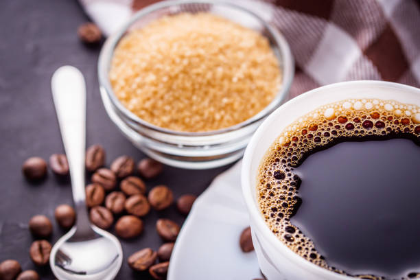 cup of fragrant fresh coffee on a dark stone background.
