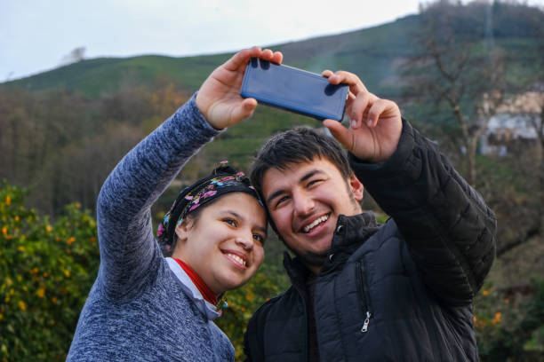 istock Country twins taking a selfie 1295075943