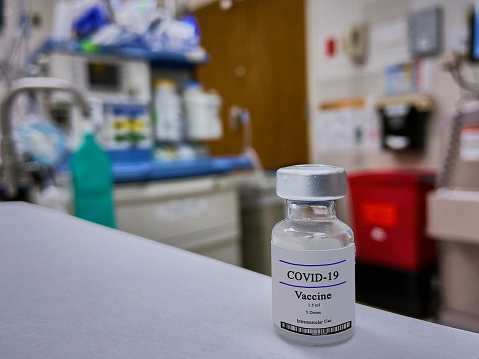 Close-up COVID-19 Vaccine in medical environment. Newest research and development against coronavirus worldwide pandemic.