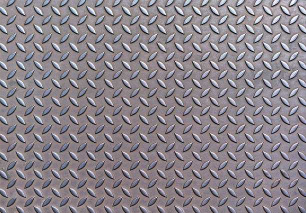 istock Background of old rusty metal diamond plate 1295077078