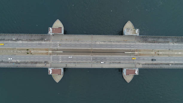 istock suspension bridge vehicle traffic Aerial view. 1295079654
