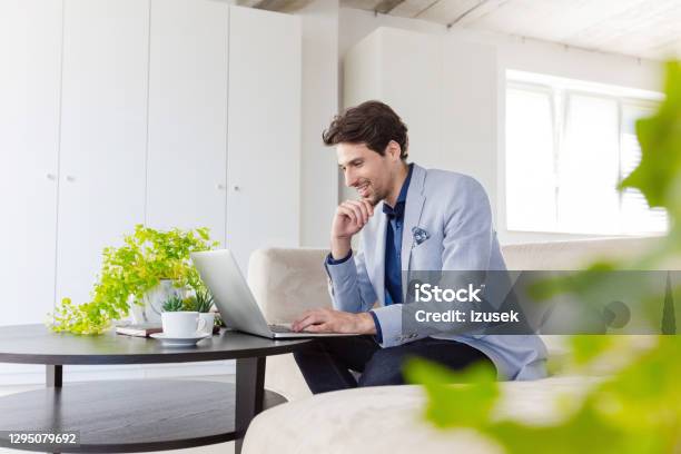 Businessman Working On Laptop In The Green Office Stock Photo - Download Image Now - Environmental Conservation, Green Color, Video Call