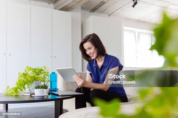 Businesswoman Working At Home Stock Photo - Download Image Now - Office, Digital Tablet, Sustainable Lifestyle