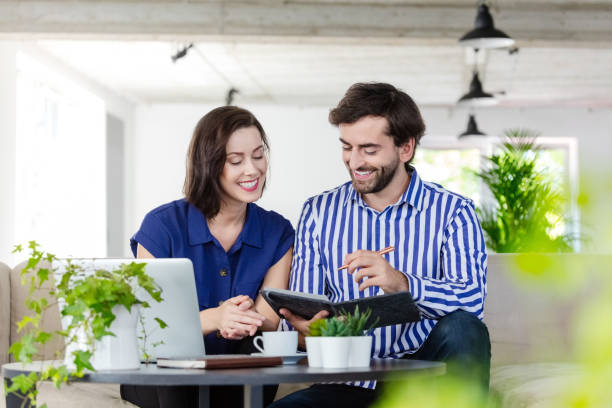 istock Coworkers working in the eco-friendly green office 1295081444