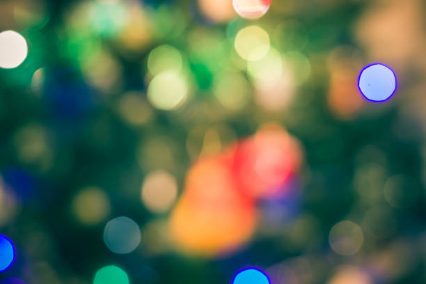 istock abstract blurred of blue and silver glittering shine bulbs lights background:blur of Christmas wallpaper decorations concept.xmas holiday festival backdrop:sparkle circle lit celebrations display . 1295081449