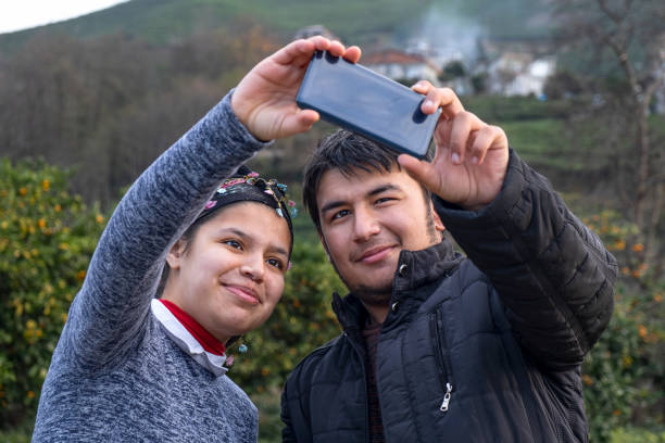 istock Country twins taking a selfie 1295081509