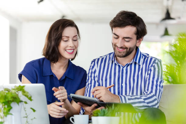 istock Coworkers working in the eco-friendly green office 1295081624
