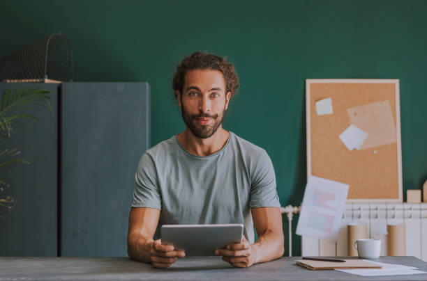 istock Portrait of a Young Man Working at Home 1295082916