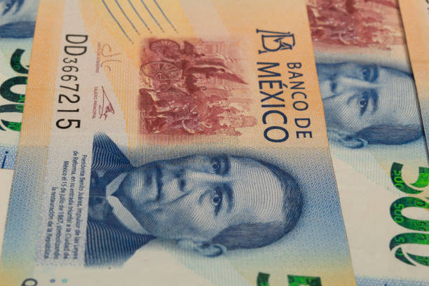 Mexican peso bills on a white background