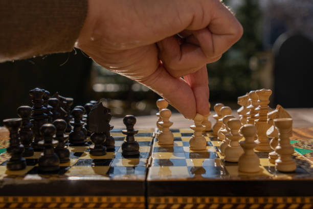 istock Man playing chess game in the morning 1295087730