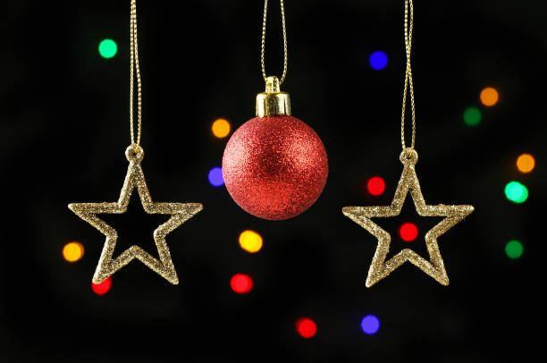 istock Bauble and stars against bokeh 1295089376