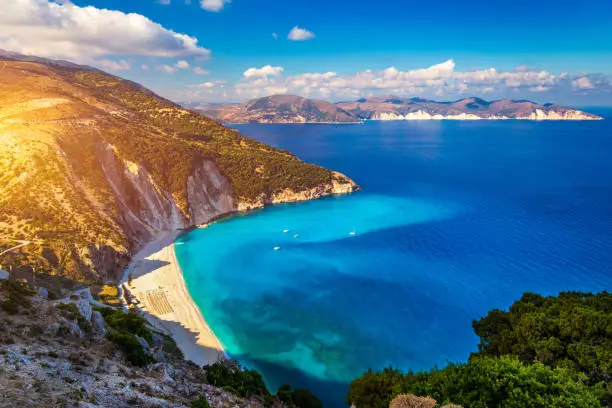 Famous Myrtos beach from overlook, Kefalonia (Cephalonia), Greece. Myrtos beach, Kefalonia island, Greece. Beautiful view of Myrtos beach, Ionian Island, Kefalonia (Cephalonia), Greece.